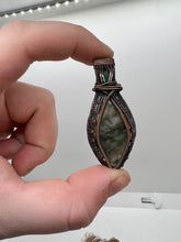 Load image into Gallery viewer, Hand Carved Moss Agate &amp; Natural Emerald Oxidized Copper Wire Wrap Pendant
