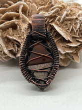 Load image into Gallery viewer, Hand Carved Dino Bone &amp; Carnelian Oxidized Copper Wire Wrap Pendant
