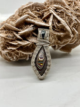 Load image into Gallery viewer, Hand Carved Fordite &amp; Hematite Sterling Silver Wire Wrap Pendant
