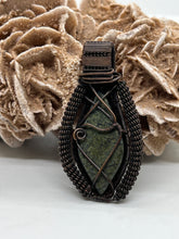 Load image into Gallery viewer, Hand Carved Serpentine Oxidized Copper Wire Wrap Pendant
