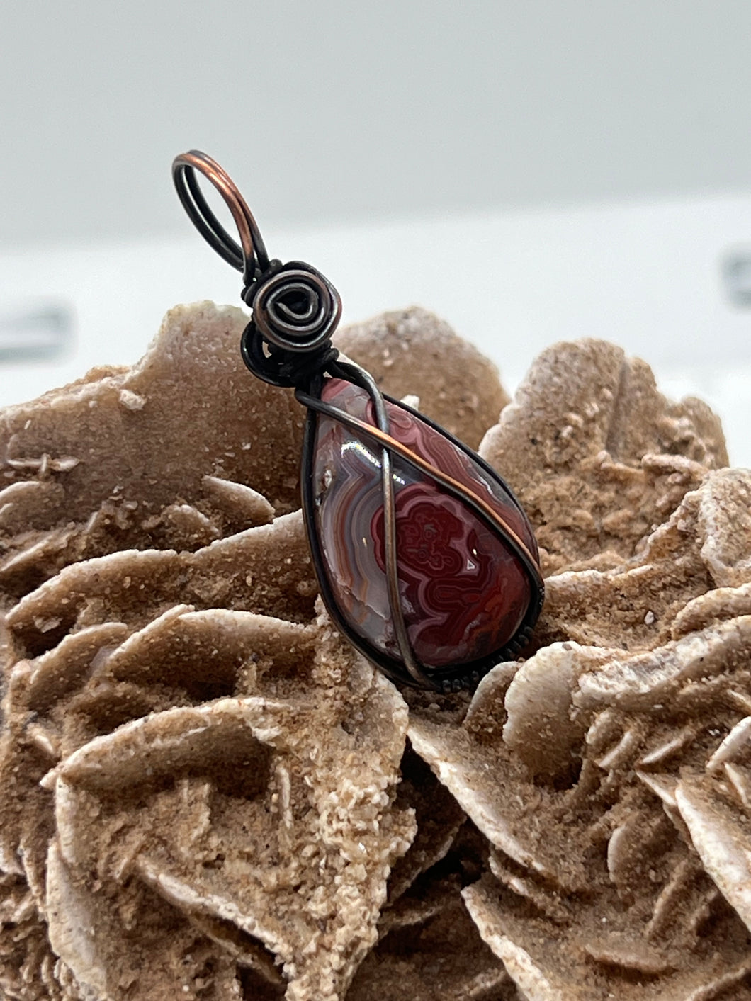 Hand Carved Crazy Lace Agate Copper Pendant