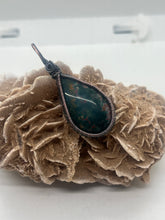 Load image into Gallery viewer, Hand Carved Orbicular Bloodstone Oxidized Copper Wire Wrap Pendant
