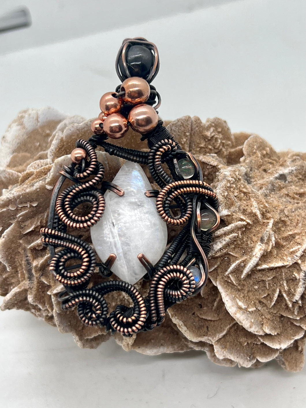 Hand Carved Rainbow Moonstone, Opal, & Star Diopside Oxidized Copper Wire Wrap Pendant