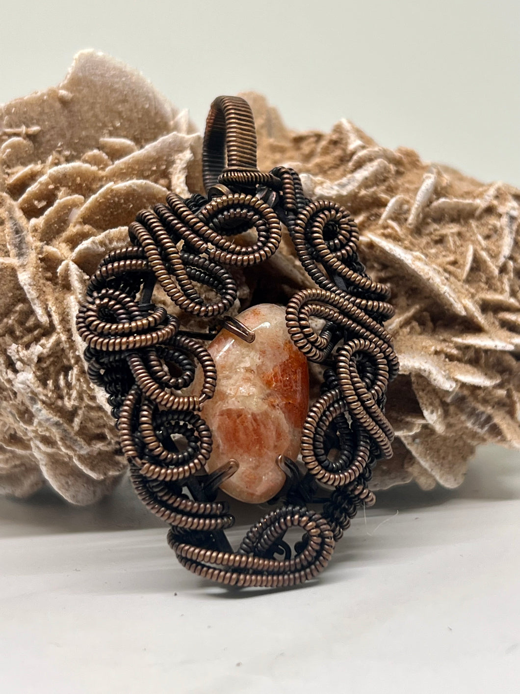 Hand carved Oregon Sunstone Oxidized Copper Wite Wrap Pendant
