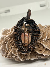 Load image into Gallery viewer, Hand carved Oregon Sunstone Oxidized Copper Wite Wrap Pendant
