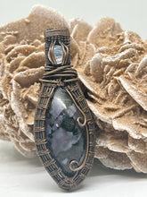 Load image into Gallery viewer, Hand Carved Indigo Gabbro Jasper &amp; Rainbow Moonstone Oxidized Copper Wire Wrap Pendant
