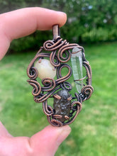 Load image into Gallery viewer, Hand Carved Opal, Colombianite, &amp; Lumerian Quartz Oxidized Copper Wire Wrap Pendant
